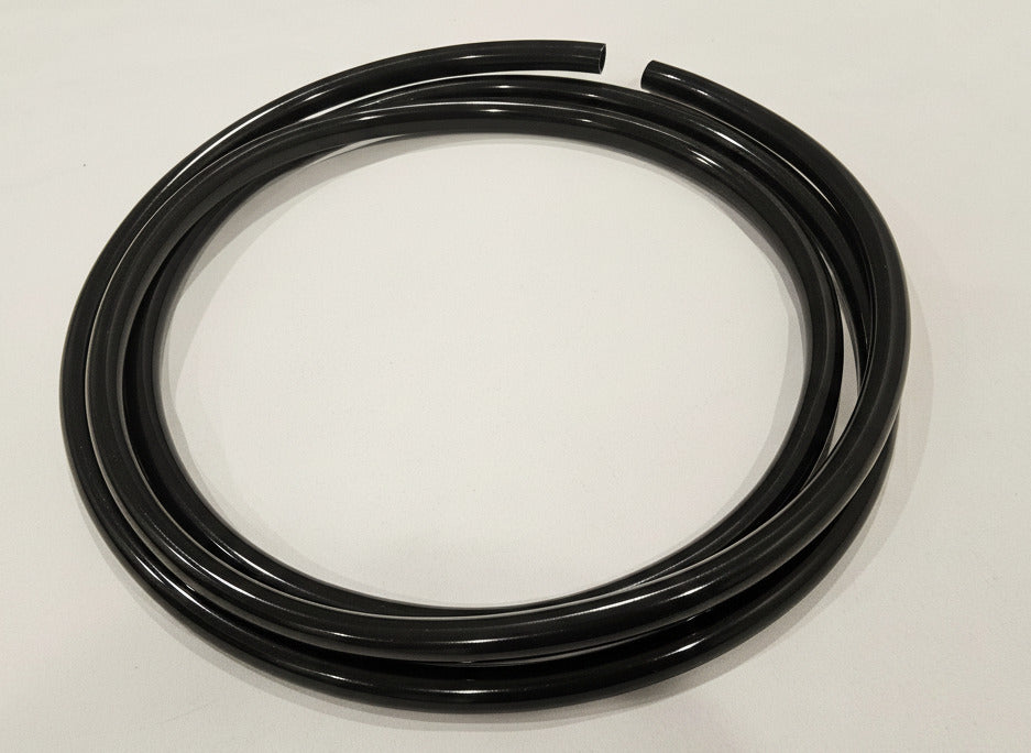 Coiled black tube on a white background